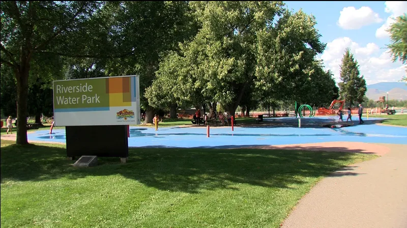 Family playing in a park in a Kamloops neighborhood